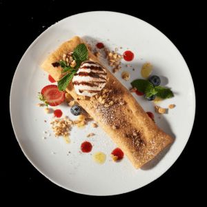 Солодкий млинець з нутелою та горіхами